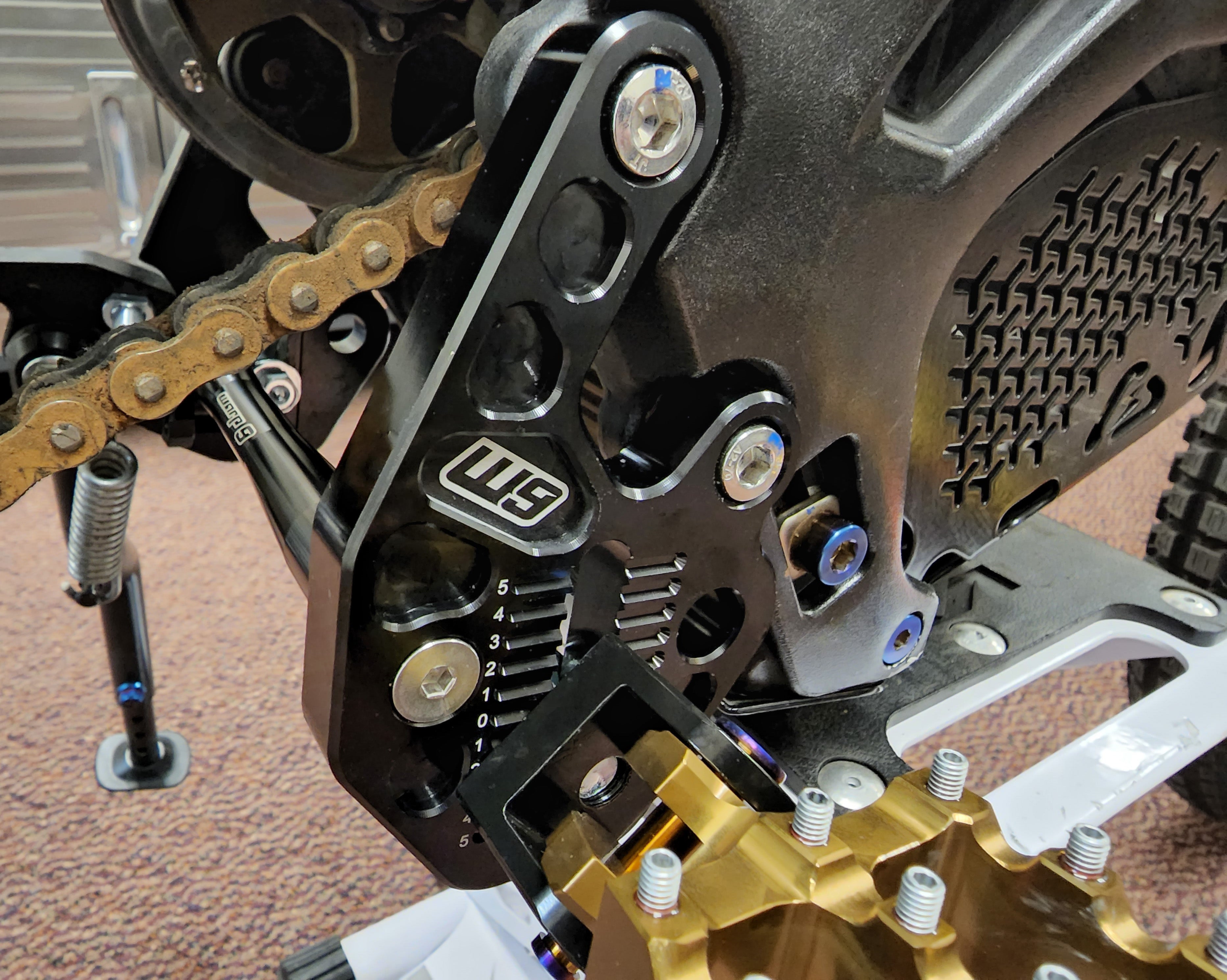 Warp 9 Surron Adjustable Footpeg Mount