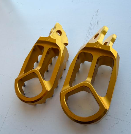 Return, Warp 9 Surron Foot Pegs Gold