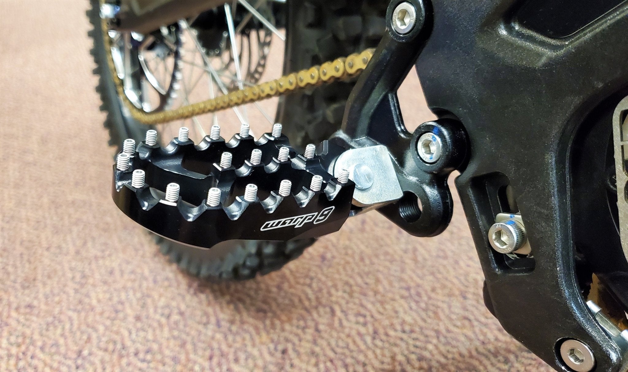 Warp 9 Surron Footpegs - TB Electric