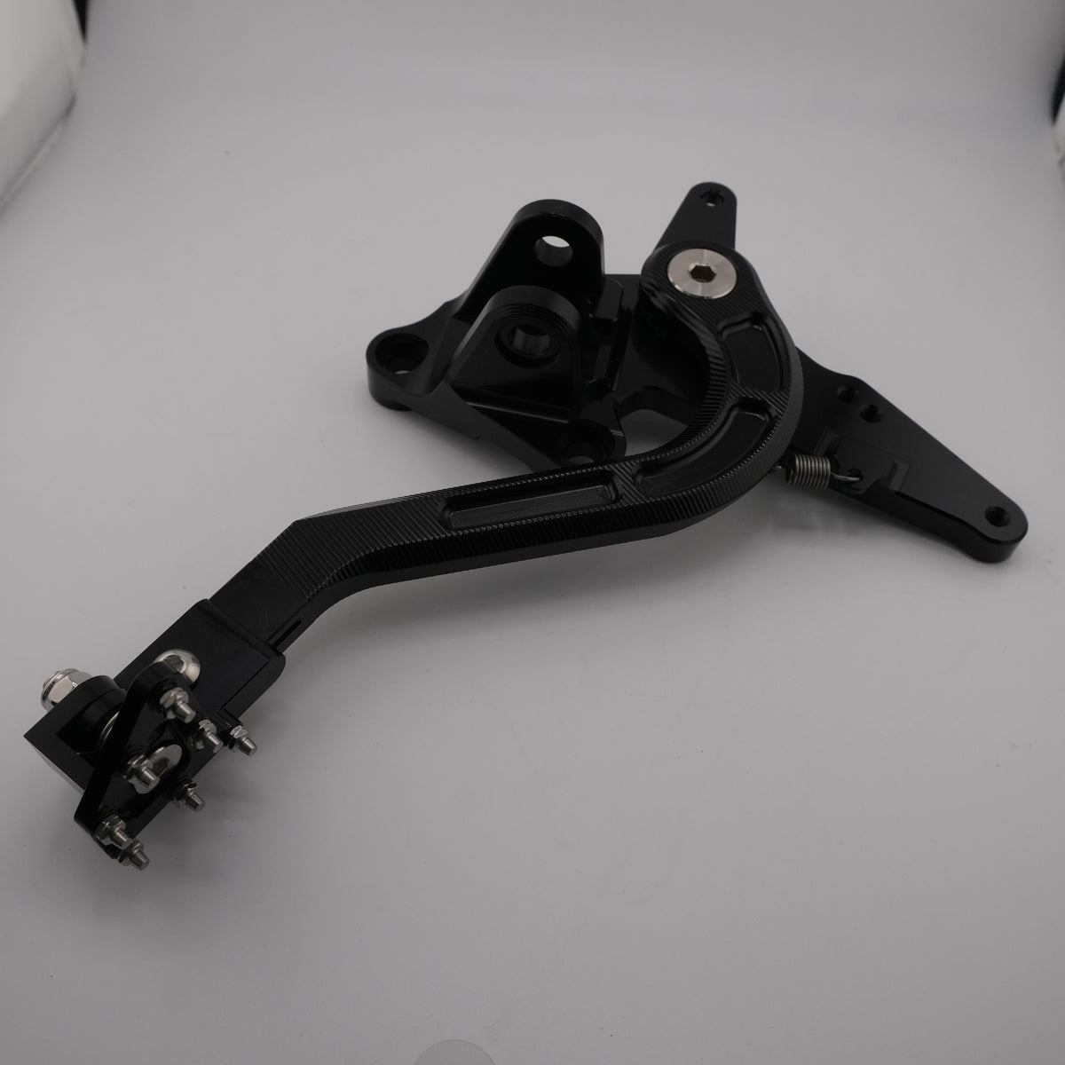 Black CNC Sur-Ron Ultra Bee foot brake pedal assembly, full length view