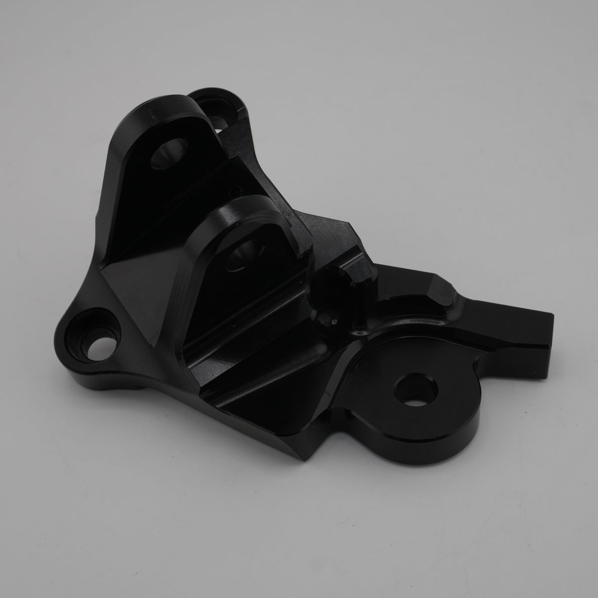 Black anodized CNC foot brake mounting bracket for the Sur-Ron Ultra Bee