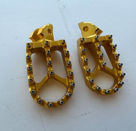 Return, Warp 9 Surron Foot Pegs Gold